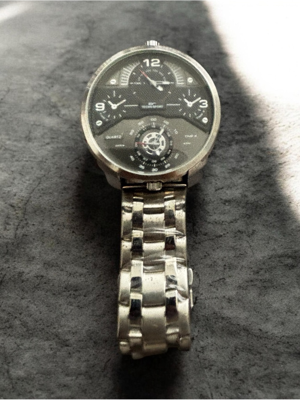 large stainless-steel, multi-time-zone quartz watch